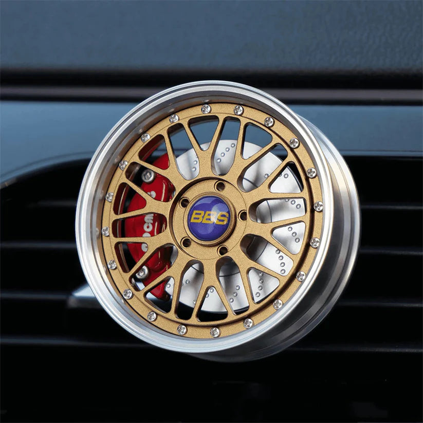 Gold rim vent diffuser for car wheels, designed to enhance airflow and aesthetics on vehicle wheel rims.