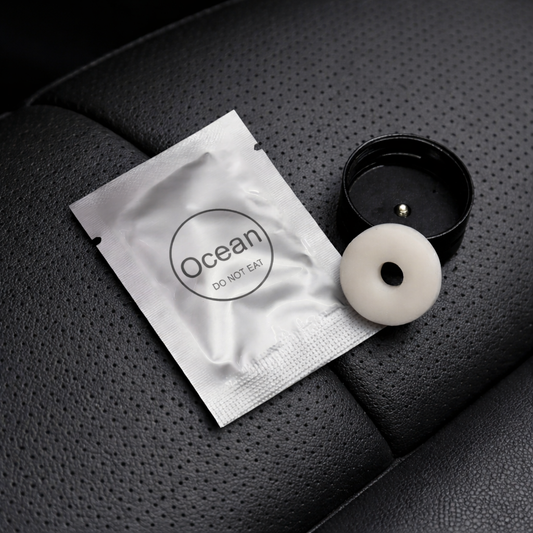 Car vent fragrance refill by My Store, showing a sleek container designed to freshen vehicle air through air vents.